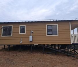 Custom-built Nutec home with timber finishes and raised foundation by Mutsamvi Construction.