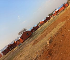 Custom-built timber log homes in a residential development by Mutsamvi Construction.